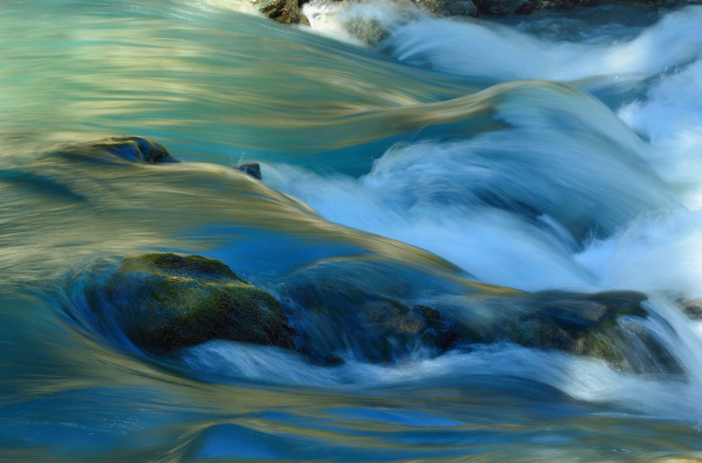 Turbulent water flow over rocks