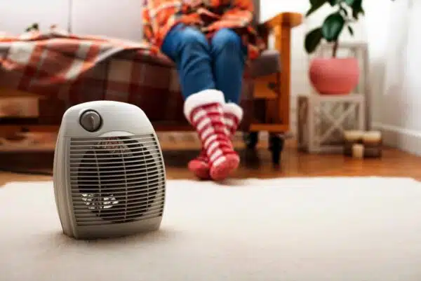 portable heater on carpet warming feet